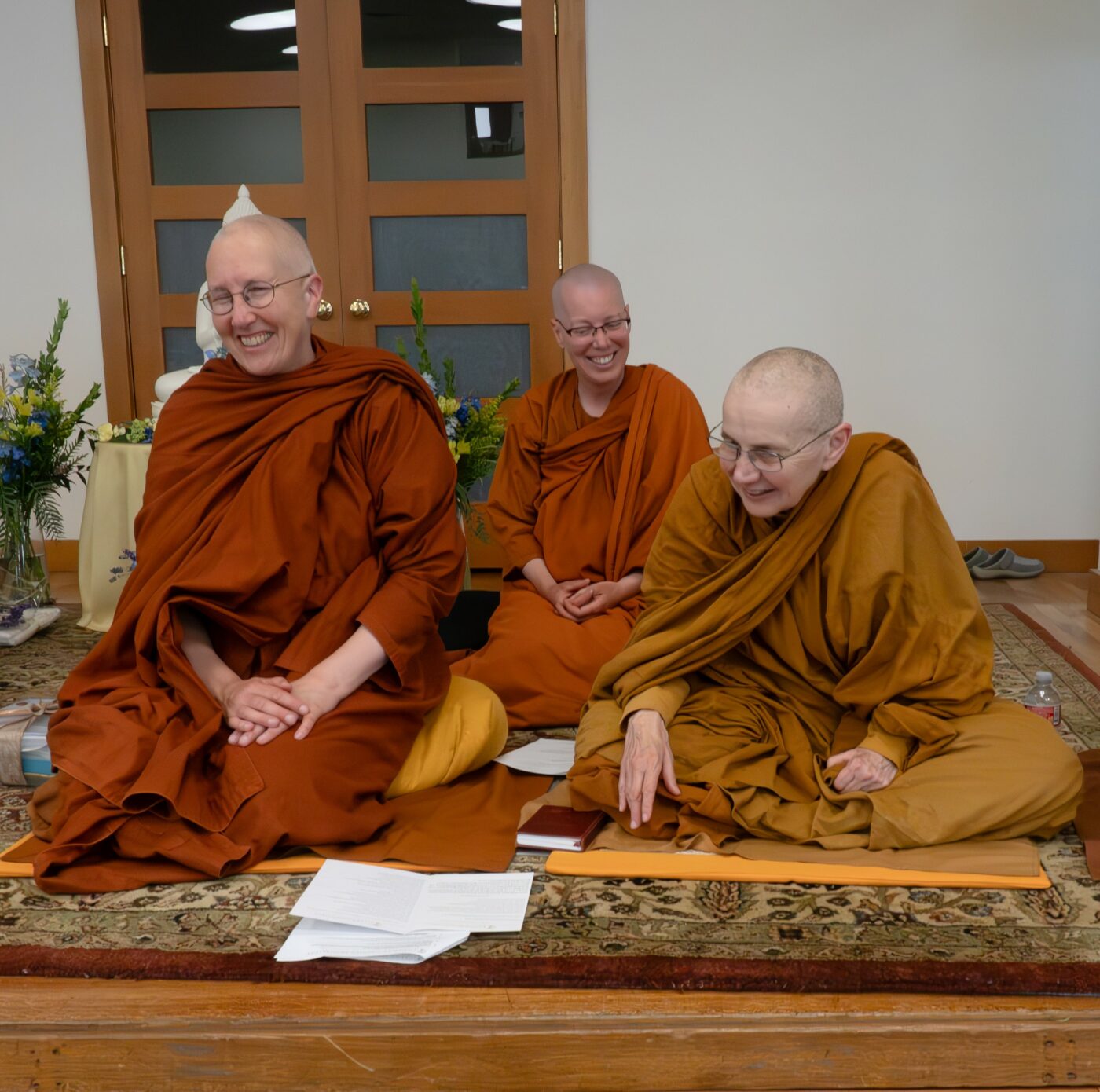 Ayyā Ānandabodhī, Sāmaṇerī Juṇhā, and Ayyā Suvijjāna greet CM3 guests with joy