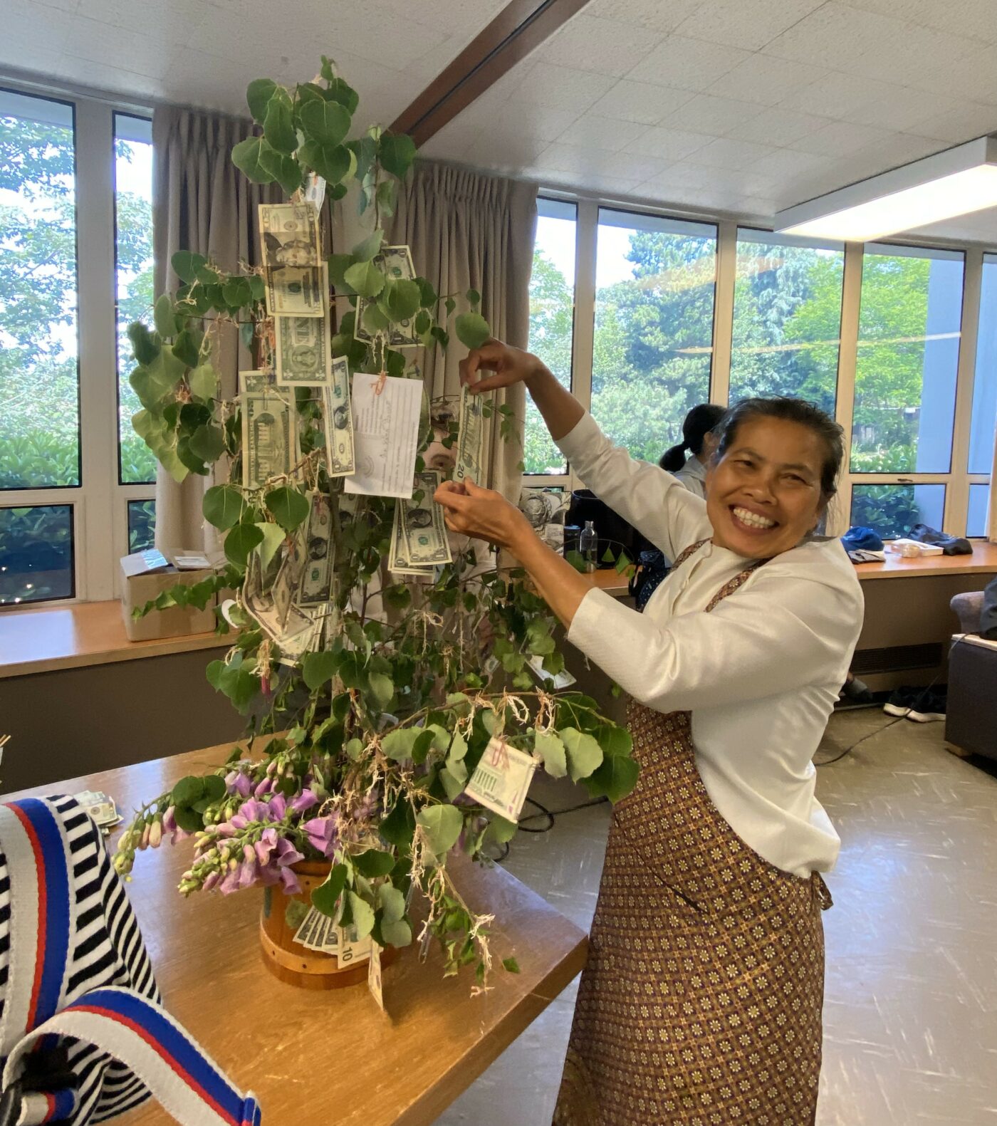 Wanida contributes to the dana tree in generous support of Clear Mountain