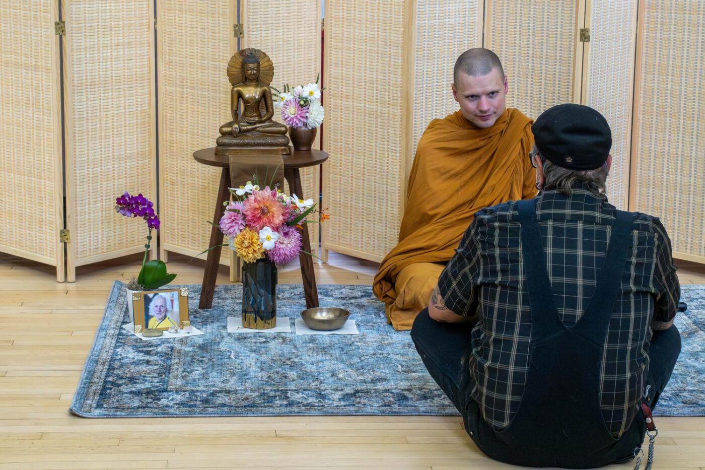 Ajahn Nisabho talks to a member of the Sangha at a Saturday Gathering in Skinner auditorium