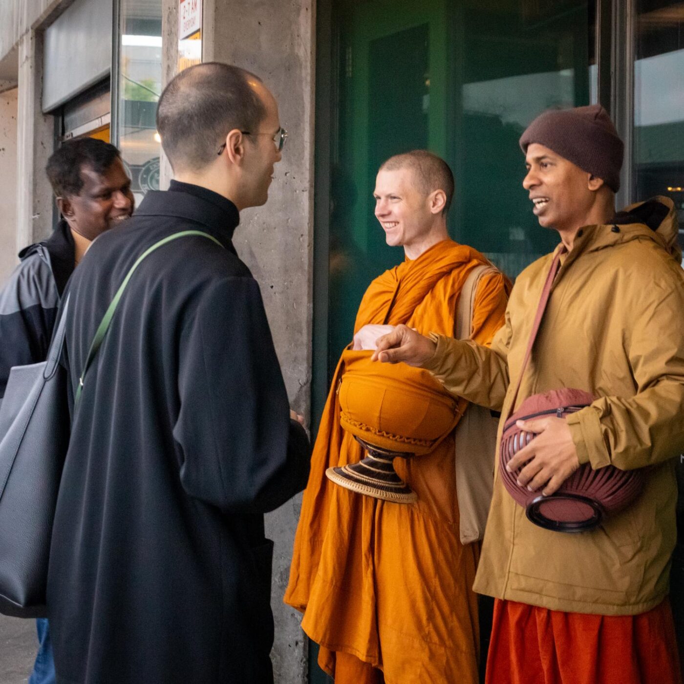 Ajahn Nisabho & Bhante Panadure Chandaratana at alms round in Pike Place Market